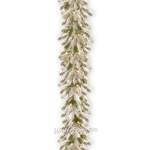 Хвойная гирлянда с лампочками Шеффилд заснеженная 274*25 см, 70 теплых белых LED ламп на батарейках, ПВХ + ЛИТАЯ National Tree Company